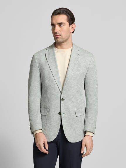 Mannermodel draagt Slim Fit 2-Knopen-Sakko met klepzakken van MCNEAL, lichtgrijze katoenmix met structuur, reverskraag, voorkant volledige lichaamsweergave.