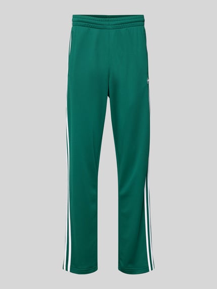 Produktfoto, Sweatpants mit elastischem Bund von adidas Originals, zielony kolor, luźny krój, wszyte logo, kieszenie, długość nogawki 81 cm