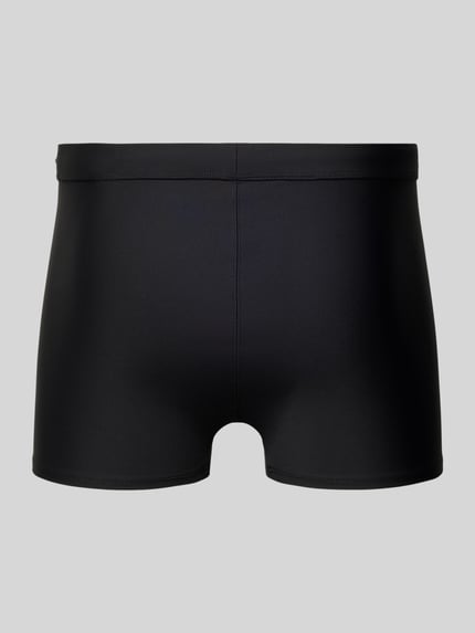 Produktfoto, schwarze Slim Fit Bade-Trunks mit Logo-Detail von Calvin Klein Underwear, elastischer Material-Mix, elastischer Bund.