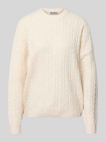 Produktfoto, Oversized Fit Strickpullover mit Zopfmuster von REVIEW, cremefarben, grobe Struktur, elastische Abschlüsse, weiches Material