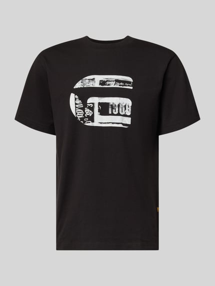 Produktfoto, schwarzes Regular Fit T-Shirt mit weißem Logo-Print, Modell 'icon' von G-Star Raw aus reiner Baumwolle, Rundhalsausschnitt.