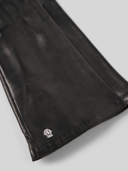 Produktfoto, schwarze Lederhandschuhe mit Label-Detail Modell 'Venedig' von Roeckl, glatte Textur, elegantes Design, Damen Lederhandschuhe