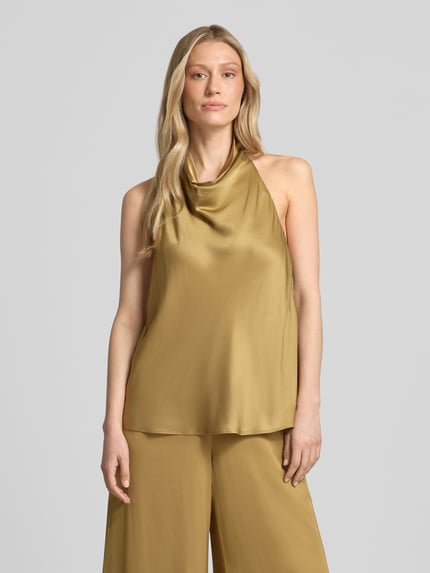 Vrouwenmodel draagt Top aus Viskose mit Neckholder und tiefem Rückenausschnitt van Jake*s cocktail in goud, recht model, zuiver viscose, halter, rugdecolleté, ruglengte bij maat 36: 70 cm, vooraanzicht bovenlichaam