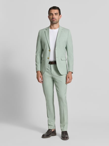Männermodel trägt mintgrünes Slim Fit Sakko mit Viskose-Anteil Modell 'LIAM' von Selected Homme, Herren Sakko, Ganzkörperansicht von vorne.