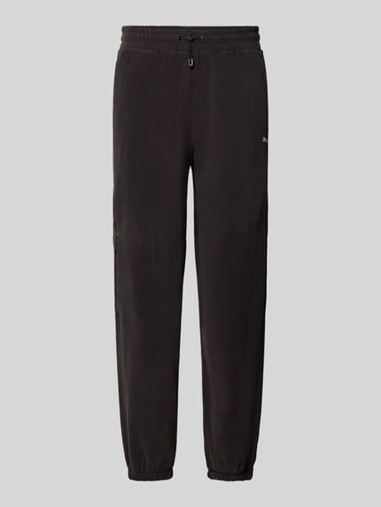 Produktfoto, Relaxed Fit Sweathose mit Logo-Print Modell 'PUMATECH' von PUMA in Schwarz, sportive Textur, Herren Sweathose von PUMA Performance