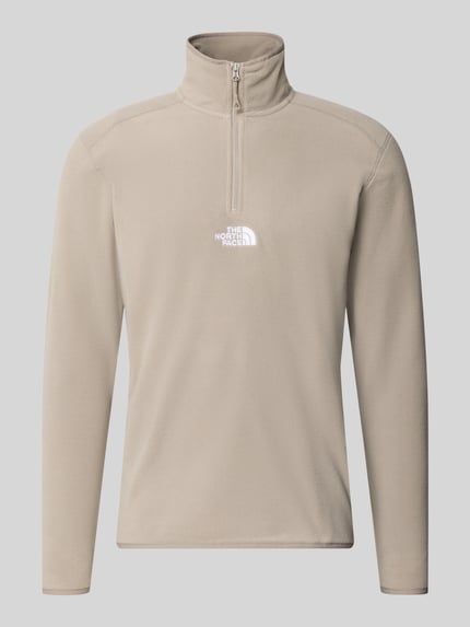 Produktfoto, Fleecepullover mit Label-Stitching von The North Face in Beige, Regular Fit, Stehkragen, Reißverschluss, glatte Textur