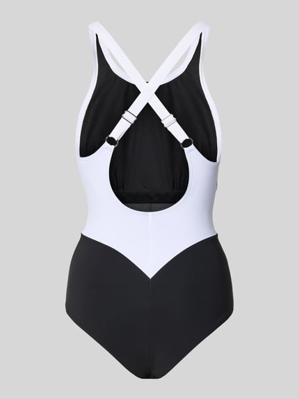 Männermodel trägt Badeanzug mit Shaping-Effekt Modell 'Silvia' von Arena, schwarz-weiß, materiał stretch, chloroodporny, ochrona UV, szybkoschnący, korpus dopasowany, Sensitive® Fabrics, widok całej sylwetki z tyłu.