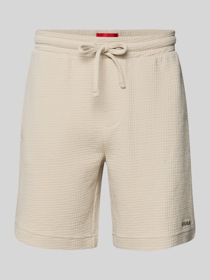 Produktfoto, Regular Fit Sweatshorts aus Baumwoll-Mix Modell 'AUSTIN' von HUGO w kolorze jednolitym, faktura wafel, z elastycznym pasem, boczne kieszenie, kontekst: męskie szorty dresowe, krój regular fit, bawełniany miks