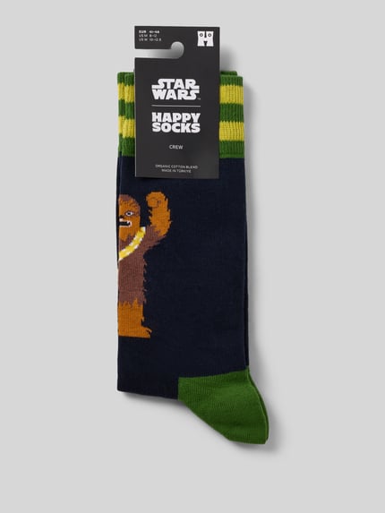 Produktfoto, Socken aus elastischem Baumwoll-Mix Modell 'Star Wars Chewie' von HAPPY SOCKS, dunkelblau mit grünem Allover-Muster, Label-Detail.