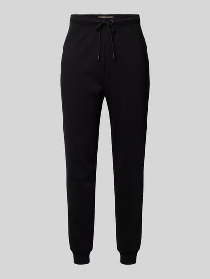 Produktfoto, schwarze Sweatpants mit Eingrifftaschen Modell 'CERES' von ONLY & SONS aus Baumwollmischung, gerader Schnitt, elastischer Bund mit Tunnelzug, elastische Beinabschlüsse und Gesäßtasche, schlichte Oberfläche.