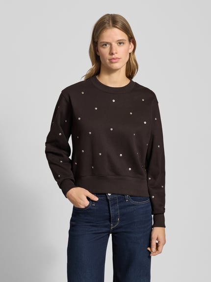 Vrouwenmodel draagt Sweatshirt met geribde afwerkingen van G-star, puur katoen, los model, ronde hals, ribboorden. Frontale borst-nahaufnahme.