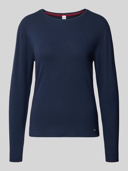 Produktfoto, Longsleeve mit geripptem Rundhalsausschnitt von Skiny für Damen aus Baumwoll-Elasthan-Mix in Regular-Fit mit Label-Detail, Rückenlänge 60 cm bei Größe 36, dunkelblaue Farbe, glatte Textur, klare Linien auf einfarbig grauem Hintergrund.