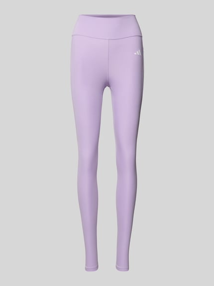 Produktfoto, Slim Fit Leggins mit Logo-Print von adidas Sportswear w kolorze liliowym, szeroki pas, elastyczny materiał, damskie