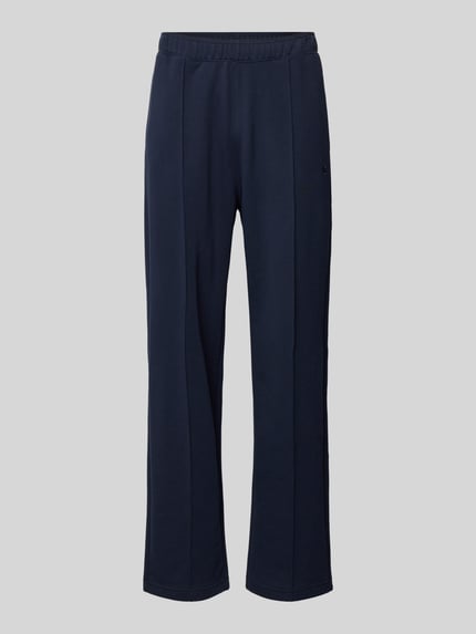 Produktfoto, Sweatpants mit Längsnähten und Label-Stitching von CHAMPION, dunkelblauer Baumwoll-Mix, Relaxed-Fit, elastischer Bund