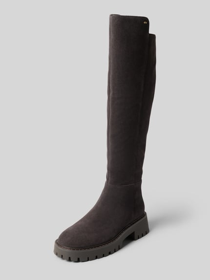 Produktfoto, Stiefel aus echtem Leder Modell 'ASHER' von MICHAEL Michael Kors, kolor ciemnobrązowy, zaokrąglony kształt, asymetryczny cholewka, profilowana podeszwa, boczny zamek błyskawiczny, wysokość obcasa 5 cm w rozmiarze 40, wysokość cholewki 47 cm w rozmiarze 40, szerokość cholewki 20 cm w rozmiarze 40, faktura gładka