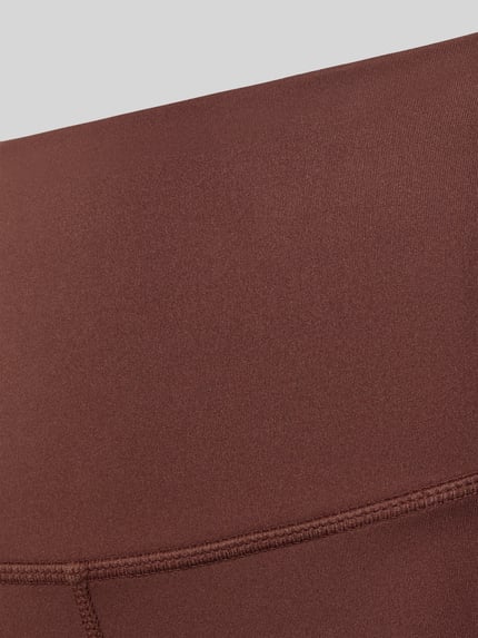Produktfoto, Leggings von VARLEY in Braun mit elastischem Bund und Kontrastnähten, glatte Textur, elastische Beinabschlüsse