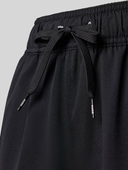 Productfoto, Badehose met elastische band van PUMA, recht pasvorm, tunnelkoord, labelprint, zwart, gladde textuur