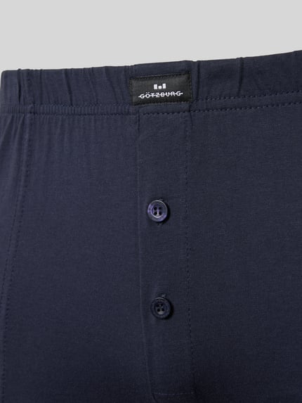 Produktfoto, Boxershorts mit elastischem Bund von Götzburg Wäsche aus reiner Baumwolle in Dunkelblau mit körpernahem Schnitt, Label-Detail und Knopfverschluss