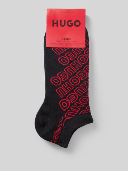 Produktfoto, czarne skarpety z mieszanki bawełny z czerwonym wzorem logo HUGO, Socken aus Baumwoll-Mix von HUGO, kontekst: skarpety męskie