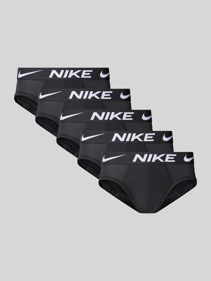 Produktfoto, Slip mit Label-Bund im 5er-Pack von Nike für Herren, schwarze Farbe, weiße Logos, glatte Oberfläche, klarer Hintergrund.
