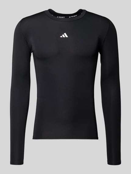 Produktfoto, Longsleeve mit Label-Print von adidas Training, czarny kolor, materiał z domieszką stretchu, krój slim fit, okrągły ściągacz przy szyi, nadruk z logo, długość tyłu w rozmiarze M: 65 cm