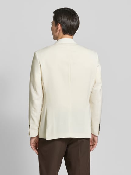 Männermodel trägt Regular Fit Anzugsakko mit Wool-Anteil von SELECTED HOMME, Optik: Unifarben, Material-Mix, Ganzkörperansicht Rückansicht.
