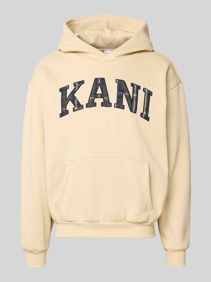 Produktfoto, Hoodie mit Label-Stitching und Känguru-Tasche von KARL KANI aus Baumwoll-Mix, oversized, beige, schwarze Schrift, glatte Textur
