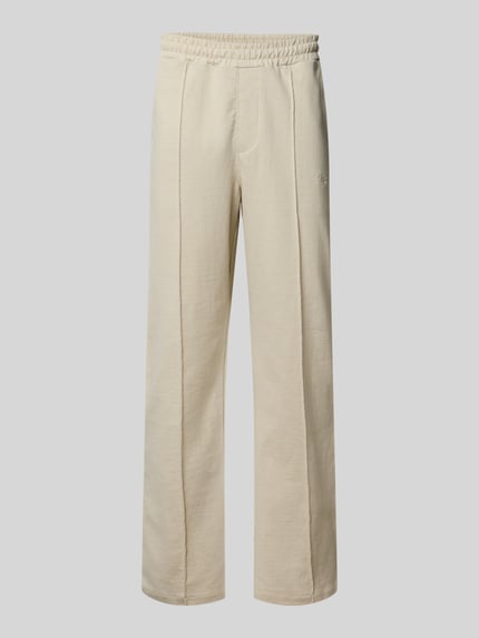 Produktfoto, beige Track Pants mit Logo-Stitching Modell 'Skagen' von Pegador aus reiner Baumwolle, locker geschnitten, strukturierte Oberfläche