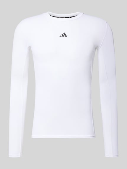 Produktfoto, Longsleeve mit Label-Print von adidas Training, biały materiał z elastycznym dodatkiem, krój slim fit, okrągły ściągaczowy dekolt, nadruk z logo, długość tyłu w rozmiarze M: 66 cm