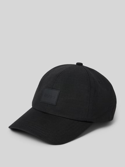 Produktfoto, schwarze Cap aus reiner Baumwolle 'JAKE-RS' von HUGO für Herren auf hellgrauem Hintergrund, strukturierte Oberfläche