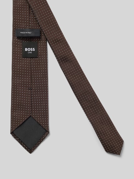 Produktfoto, Krawatte aus reiner Seide mit Allover-Muster Modell 'ONE' von BOSS in Braun mit kleinen weißen Punkten auf glatter Textur, Herren Krawatte von BOSS