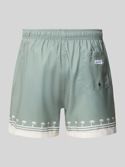 Produktfoto, grün-weiße Badehose mit elastischem Bund Modell 'Shore Palm' von BOARDIES, Regular-Fit, Palmen-Print, Tunnelzug, Herren Bademode