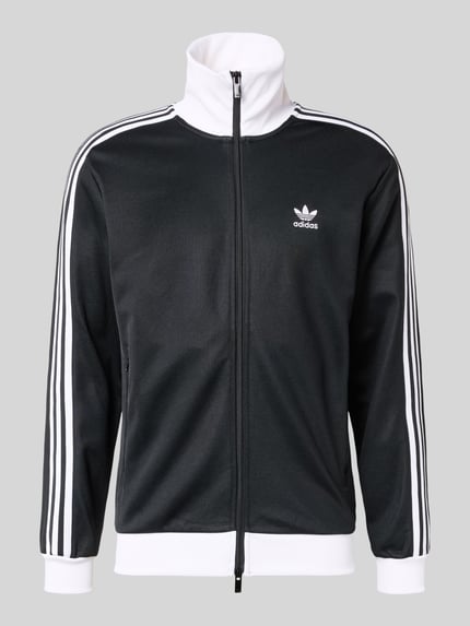 Produktfoto, Sweatjacke mit Reißverschluss van adidas Originals in zwart met witte strepen, katoenmix, los model, geribde boorden, steekzakken, zichtbare rits.
