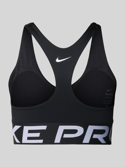 Produktfoto, Racerback-Bustier mit Cut Out und Label-Details von NIKE TRAINING, schwarzer Material-Mix mit Stretch-Anteil, körpernahe Passform