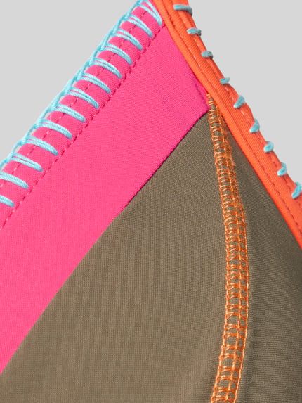 Productfoto, Bikini-Oberteil im Allover-Look Modell 'TEKNICOLOR Taeko' van Banana Moon, kleurvlakken roze, bruin, oranje, blauwe stiksels, materiaal-mix met stretch, gladde textuur, naaddetail