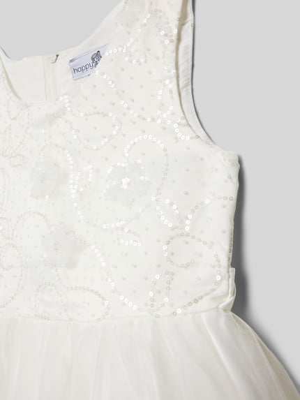 Mädchen trägt Sukienka z cekinami o linii A z okrągłym dekoltem, zamek błyskawiczny z tyłu, Happy Girls, długość tyłu 76 cm, rozmiar 134, detailaufnahme.