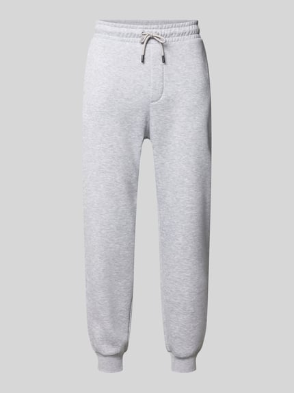 Produktfoto, Regular Fit Sweatpants mit Eingrifftaschen Modell 'GORDON' van JACK & JONES voor heren van materiaalmix met katoen, elastische band met tunnelkoord, gulp, steekzakken, achterzak, binnenbeenlengte maat M 70 cm, lichtgrijs, zacht oppervlak, ronde vormen, gemêleerde textuur