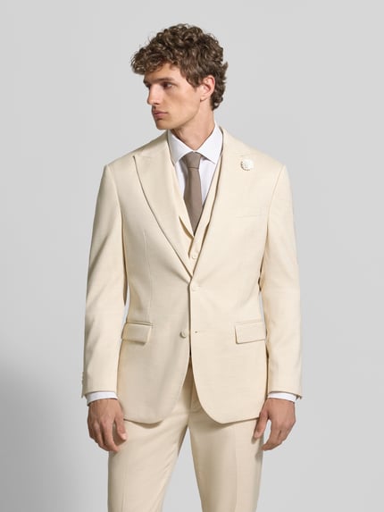 Männermodel trägt Slim Fit 2-knoops colbert met linnenmix van MCNEAL in crème, met reverskraag, bloemdetail, paspelzak op de borst, klepzakken, materiaalmix met linnen, ruglengte bij maat 50: 73 cm, schouderbreedte: 45 cm, mouwlengte: 66 cm, ganzkörperansicht van voren.