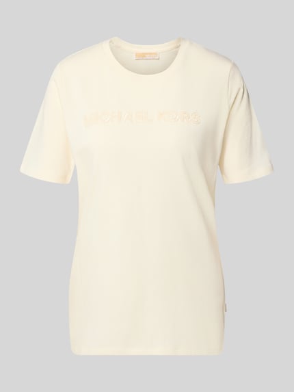 Produktfoto, cremefarbenes T-Shirt mit Label-Stitching von MICHAEL Michael Kors, reine Baumwolle, gerader Schnitt, Rundhalsausschnitt