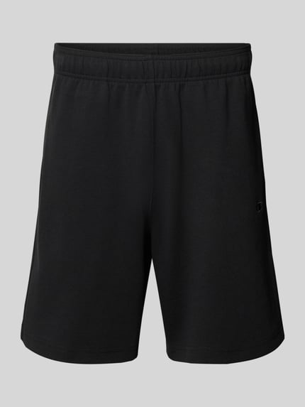 Produktfoto, Shorts mit Label-Stitching mit elastischem Bund von CHAMPION im Regular Fit aus schwarzem Baumwoll-Mix, glatte Textur.
