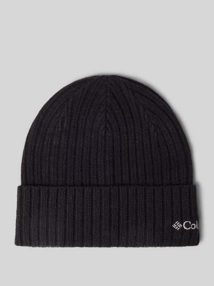Produktfoto, schwarze Mütze in Strick-Optik Modell 'COLUMBIA' von Columbia mit fixiertem Saum und Logo-Detail auf grauem Hintergrund.