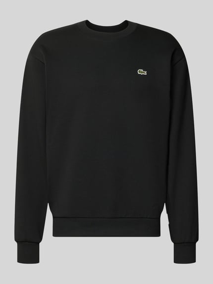 Produktfoto, Regular Fit Sweatshirt aus Baumwoll-Mix von Lacoste in Schwarz mit rundem Halsausschnitt, Rippenbündchen und glatter Struktur.