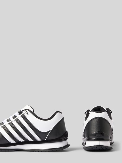 Produktfoto, Sneaker aus leer met labeldetails model 'Rinzler' van K-SWISS voor heren, gecoat leer, afgerond model, profielzool, zwart-wit, maat 44 hakhoogte 3 cm, schachthoogte 9 cm, schachtbreedte 9 cm