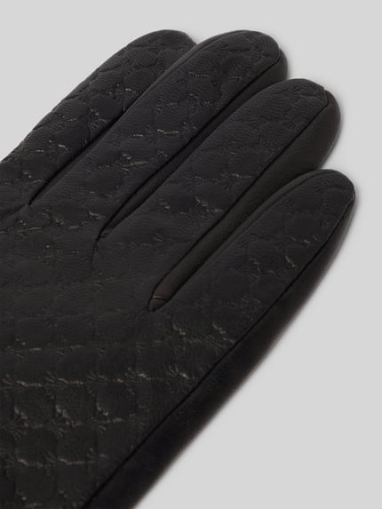 Produktfoto, Handschuhe aus Ziegenleder mit Riemen und Druckknopfverschluss von JOOP! Collection, schwarzes Ziegenleder, Fingerhandschuhe, sichtbare Nähte, feine Textur