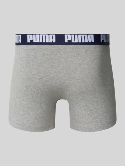 Produktfoto, grauer Trunk aus Baumwoll-Mix mit dunkelblauem Bund und weißem PUMA-Schriftzug, Modell 'Everyday' von PUMA, glatte Textur