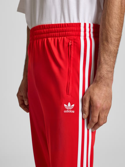 adidas Originals Spodnie dresowe z elastycznym ściągaczem Czerwony 3