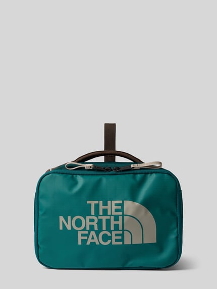 Produktfoto, Kulturbeutel mit Logo-Print Modell 'Voyager' von The North Face in Türkis mit Reißverschluss, Trageriemen und Innenfächern, rechteckige Form, glatte Oberfläche