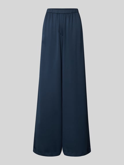 loose fit pants met elastische tailleband en steekzakken Shop The Look MANNEQUINE