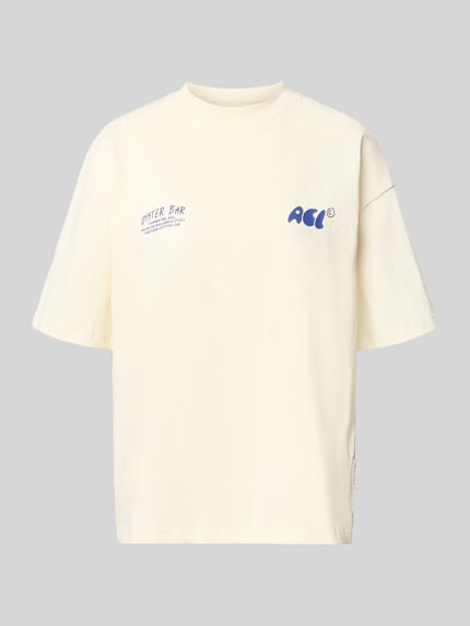 Produktfoto, Oversized T-Shirt mit Label-Prints von ANOTHER COTTON LAB, damski t-shirt z bawełny, krój oversized, nadruki z logo, okrągły dekolt, długość tyłu w rozmiarze S: 64 cm