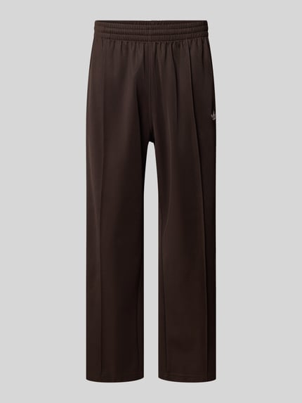 Produktfoto, Straight Fit Sweatpants mit Logo-Stitching Modell 'Firebird' von adidas Originals, Mieszanka bawełny, krój straight fit, ozdobny szew, elastyczny pas, długość wewnętrzna nogawki w rozmiarze M: 69 cm, kolor ciemny brąz, gładka tekstura